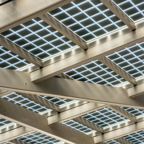 Abstract view of a modern solar panel structure with geometric patterns.